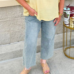 Golden yellow short sleeve blouse with a relaxed fit and dolman sleeves, styled for casual or dressy occasions.