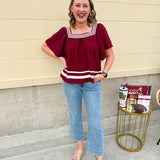 Garnet square neck woven top with white contrast tape on neckline and hem—lightweight and stylish for FSU gameday