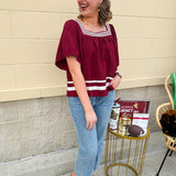 Garnet square neck woven top with white contrast tape on neckline and hem—lightweight and stylish for FSU gameday