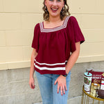 Garnet square neck woven top with white contrast tape on neckline and hem—lightweight and stylish for FSU gameday