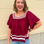 Garnet square neck woven top with white contrast tape on neckline and hem—lightweight and stylish for FSU gameday