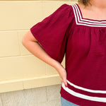Garnet square neck woven top with white contrast tape on neckline and hem—lightweight and stylish for FSU gameday