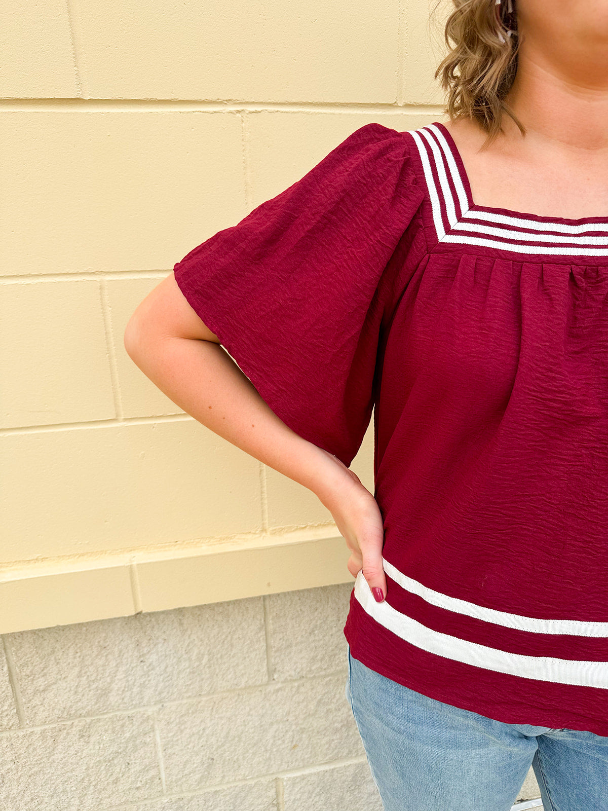 Garnet square neck woven top with white contrast tape on neckline and hem—lightweight and stylish for FSU gameday