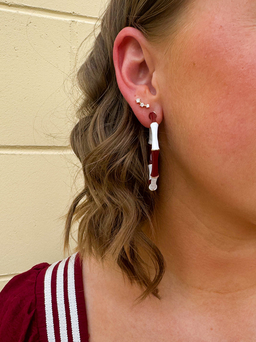 Garnet and white striped enamel hoop earrings with gold trim