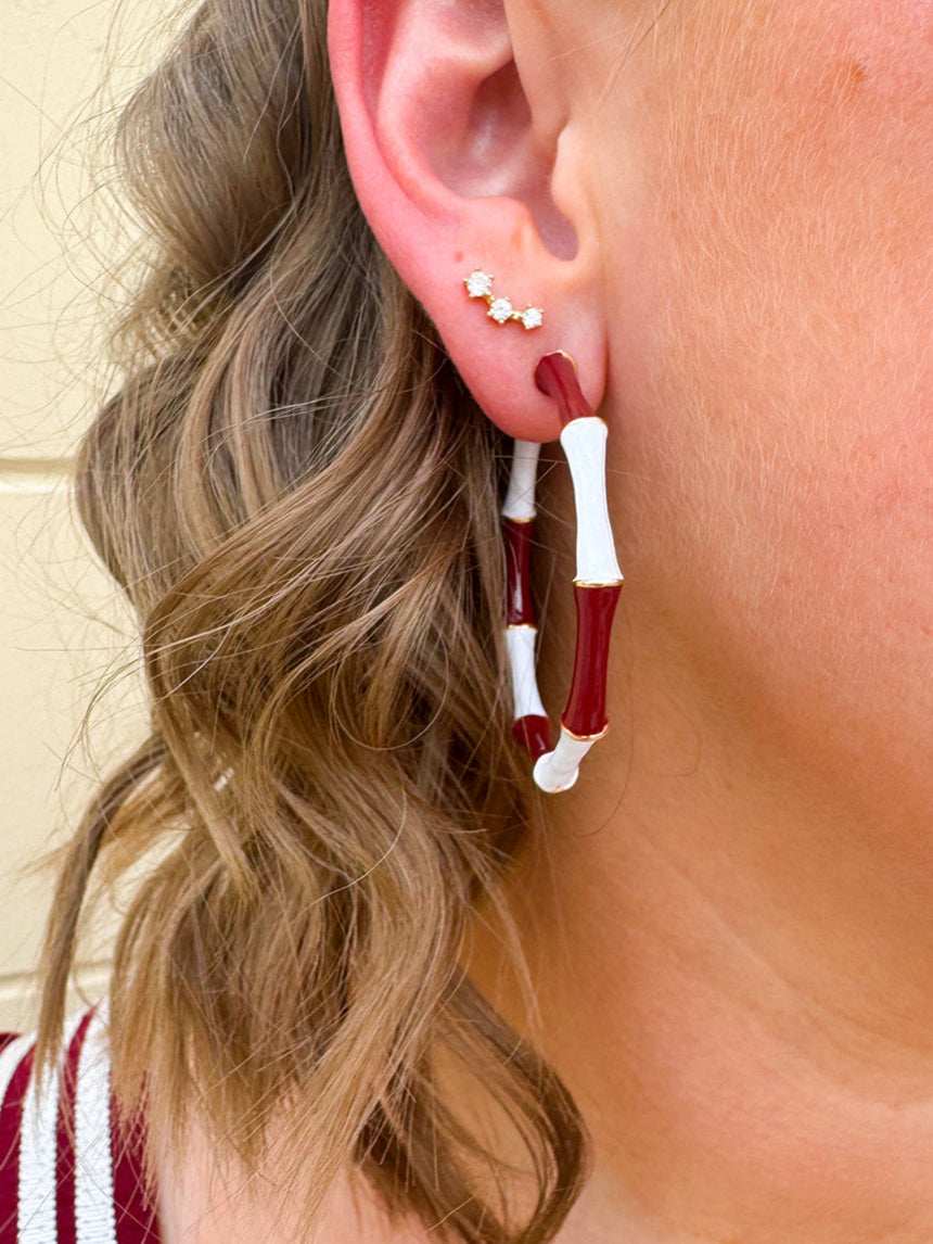 Garnet and white striped enamel hoop earrings with gold trim