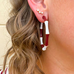 Garnet and white striped enamel hoop earrings with gold trim