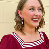 Garnet and white striped enamel hoop earrings with gold trim