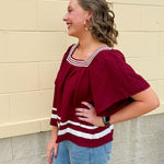 Garnet square neck woven top with white contrast tape on neckline and hem—lightweight and stylish for FSU gameday