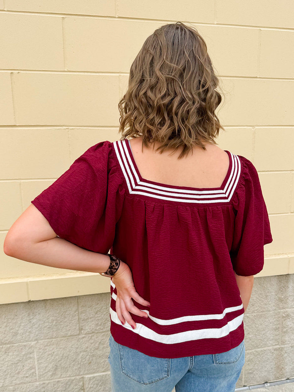 Garnet square neck woven top with white contrast tape on neckline and hem—lightweight and stylish for FSU gameday