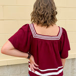 Garnet square neck woven top with white contrast tape on neckline and hem—lightweight and stylish for FSU gameday