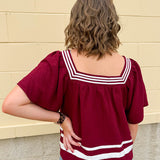 Garnet square neck woven top with white contrast tape on neckline and hem—lightweight and stylish for FSU gameday