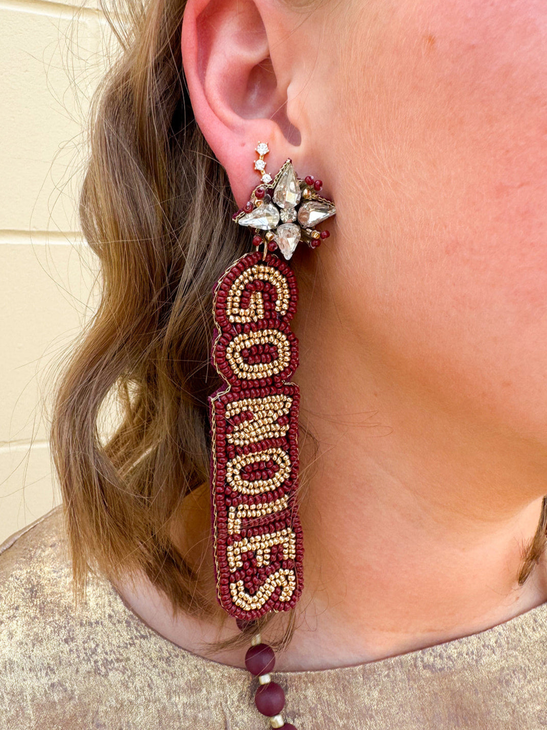  Garnet and gold hand beaded earrings with “Go Noles” lettering and crystal cluster studs, perfect for FSU fans.