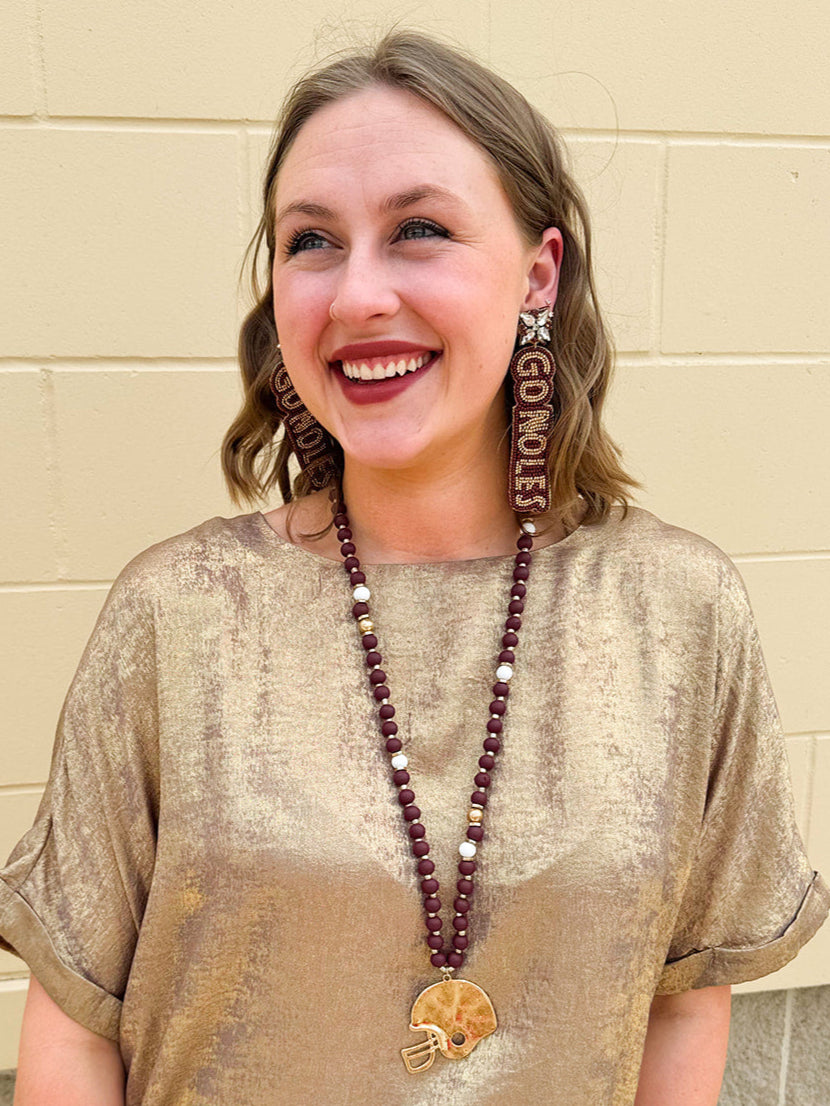  Garnet and gold hand beaded earrings with “Go Noles” lettering and crystal cluster studs, perfect for FSU fans.