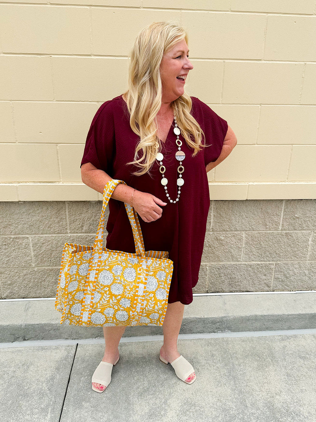 Garnet short sleeve mini dress with deep V-neck, drop shoulders, and side pockets—perfect for gameday.
