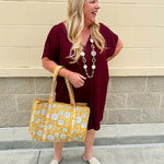 Garnet short sleeve mini dress with deep V-neck, drop shoulders, and side pockets—perfect for gameday.
