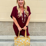 Garnet short sleeve mini dress with deep V-neck, drop shoulders, and side pockets—perfect for gameday.