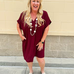 Garnet short sleeve mini dress with deep V-neck, drop shoulders, and side pockets—perfect for gameday.