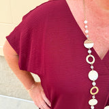Garnet short sleeve mini dress with deep V-neck, drop shoulders, and side pockets—perfect for gameday.