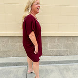 Garnet short sleeve mini dress with deep V-neck, drop shoulders, and side pockets—perfect for gameday.