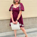 Garnet embroidered mini dress with puff sleeves, square neck, floral detailing, and scalloped hem—perfect for FSU gameday