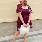 Garnet embroidered mini dress with puff sleeves, square neck, floral detailing, and scalloped hem—perfect for FSU gameday