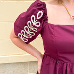 Garnet embroidered mini dress with puff sleeves, square neck, floral detailing, and scalloped hem—perfect for FSU gameday