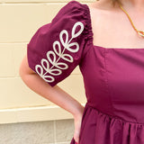 Garnet embroidered mini dress with puff sleeves, square neck, floral detailing, and scalloped hem—perfect for FSU gameday