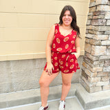 Garnet sleeveless romper with football print and side pockets, styled for game day