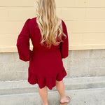 Garnet long sleeve woven mini dress with V-neckline, elastic waist, tiered hem, and pockets—lightweight and perfect for early fall wear
