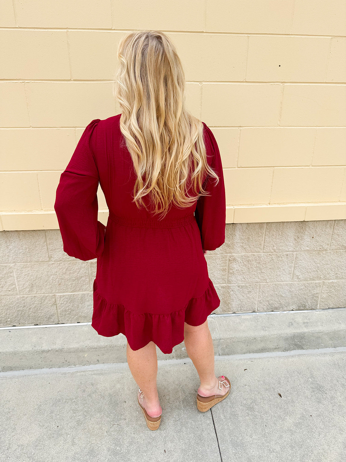 Garnet long sleeve woven mini dress with V-neckline, elastic waist, tiered hem, and pockets—lightweight and perfect for early fall wear