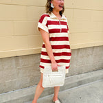 Mini dress with a zippered split-neck collar, cuffed sleeves, and colorblock-style stripes—sporty, stylish, and perfect for Gameday wear.