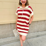 Mini dress with a zippered split-neck collar, cuffed sleeves, and colorblock-style stripes—sporty, stylish, and perfect for Gameday wear.