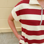 Mini dress with a zippered split-neck collar, cuffed sleeves, and colorblock-style stripes—sporty, stylish, and perfect for Gameday wear.