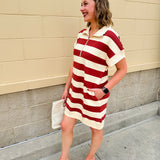 Mini dress with a zippered split-neck collar, cuffed sleeves, and colorblock-style stripes—sporty, stylish, and perfect for Gameday wear.