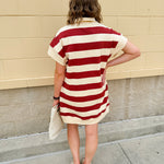 Mini dress with a zippered split-neck collar, cuffed sleeves, and colorblock-style stripes—sporty, stylish, and perfect for Gameday wear.