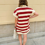 Mini dress with a zippered split-neck collar, cuffed sleeves, and colorblock-style stripes—sporty, stylish, and perfect for Gameday wear.