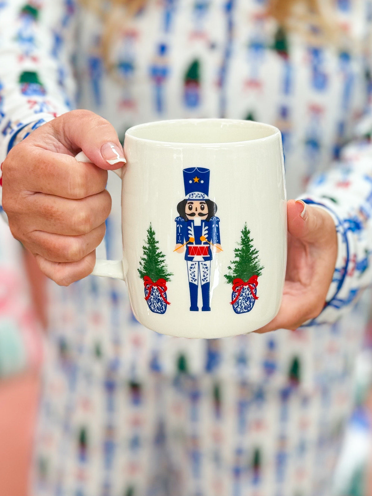 White ceramic mug featuring nutcracker illustration from the Nutcracker Dreams print.