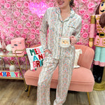 Pastel floral pajama set with long sleeves and matching pants in pink, blue, green, and orange
