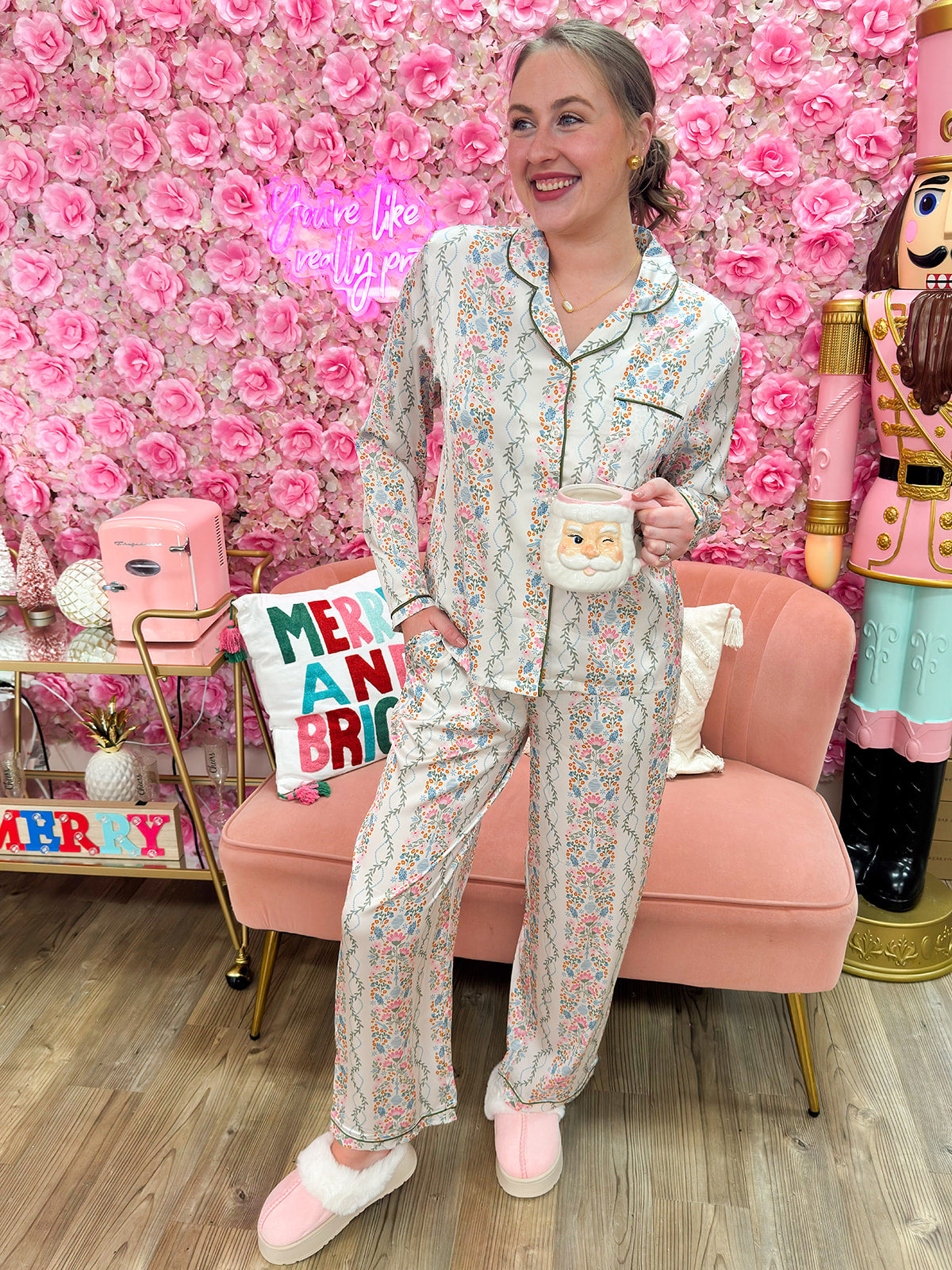 Pastel floral pajama set with long sleeves and matching pants in pink, blue, green, and orange