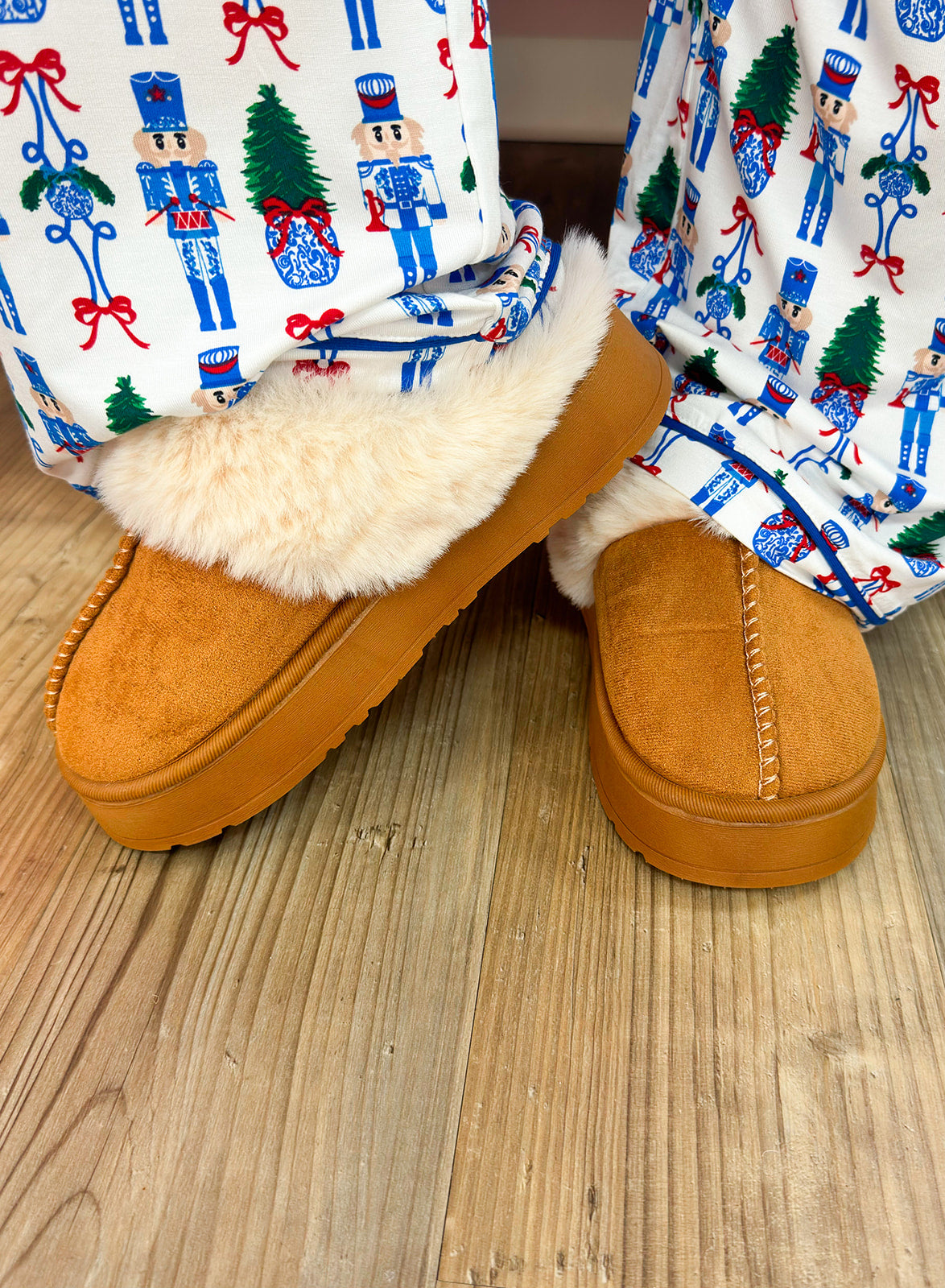 Camel faux suede platform slippers with sherpa lining and faux fur trim.