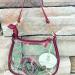 Clear crossbody stadium bag with garnet straps and gold hardware, perfect for stylish game day looks.