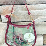 Clear crossbody stadium bag with garnet straps and gold hardware, perfect for stylish game day looks.