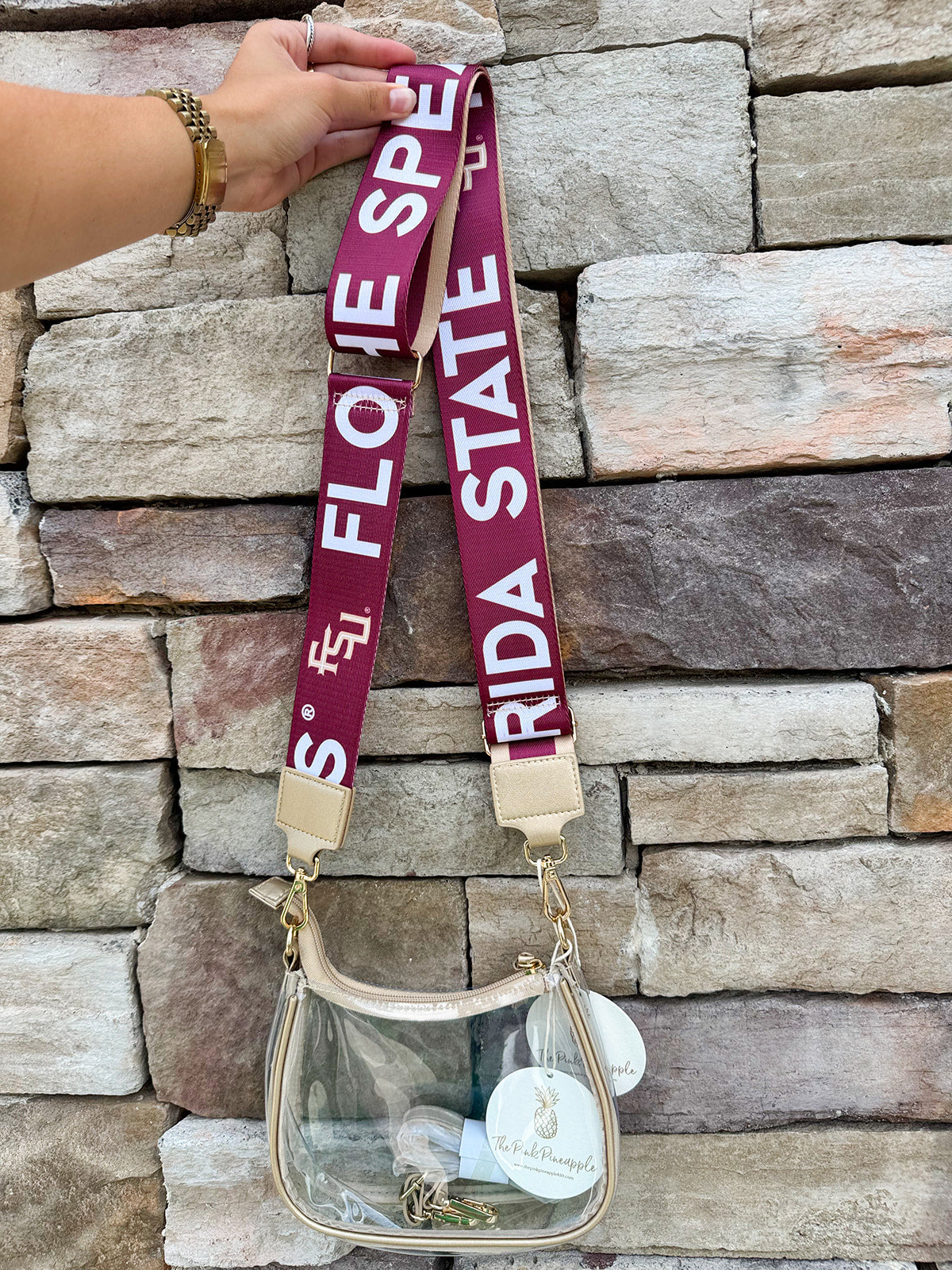 Reversible garnet and gold FSU purse strap with "Fear the Spear" and "Go Noles" text, adjustable with brass hardware.