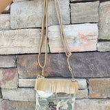 Clear crossbody purse with gold vegan leather, fringe trim, and FSU logo, designed for stadium approval and style.