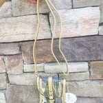 Clear crossbody bag with gold faux leather trim and belt buckle accent, perfect for stadium entry.