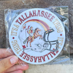 Round coasters with Renegade and Osceola on a football helmet framed by “It’s a Tallahassee Thing,” with garnet-and-gold pattern on the reverse.