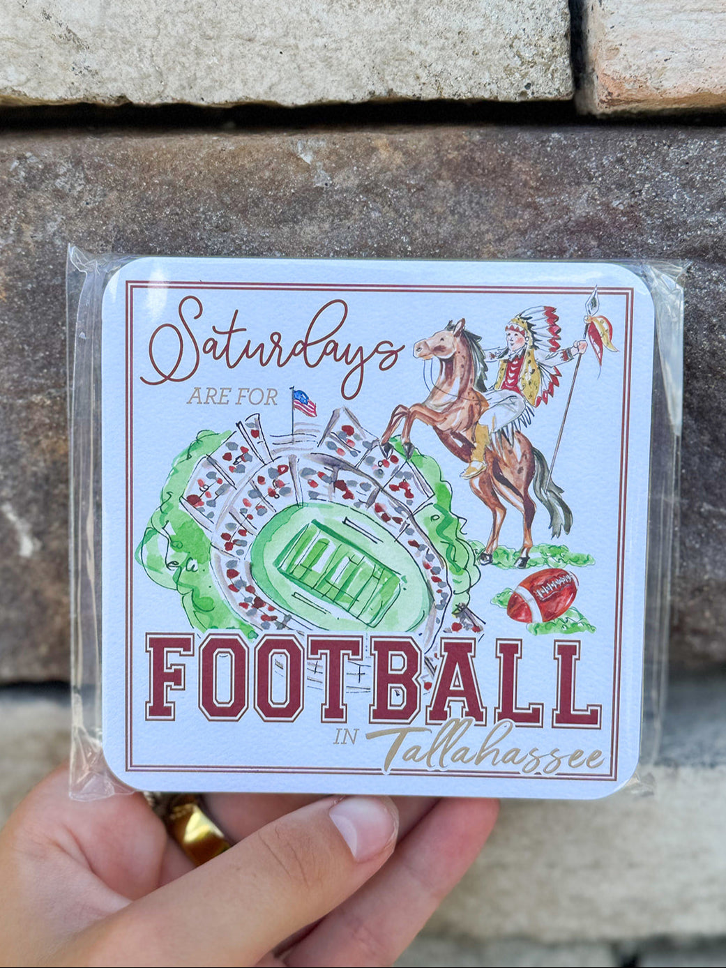 Double-sided coaster set featuring Renegade and Osceola design on one side and coordinating garnet-and-gold pattern on the other.c