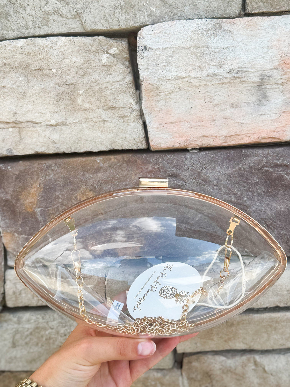 Clear Football shaped Stadium Purse with gold chain.