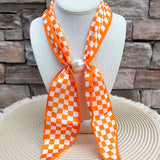 Orange and white Tennessee Volunteers magnetic pearl scarf necklace with silky checkerboard scarf and magnetic pearl clasp.