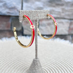 Gold hoop earrings with red enamel detailing and the Georgia Bulldogs "G" logo.